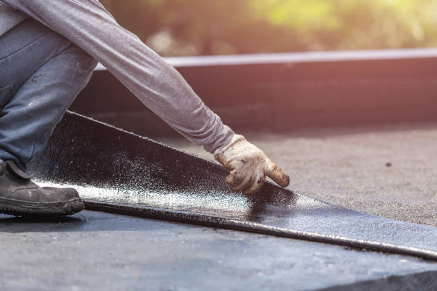 Professional Basement Waterproofing technician working in Bennington, IN